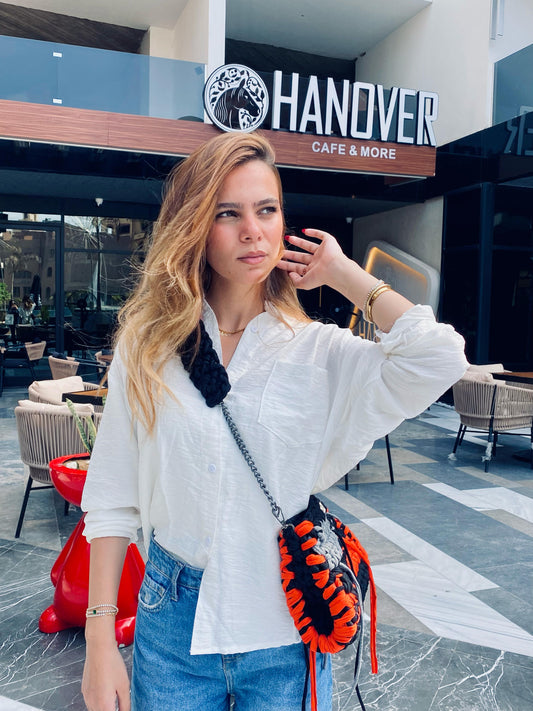 A achunky shoulder and crossy bag