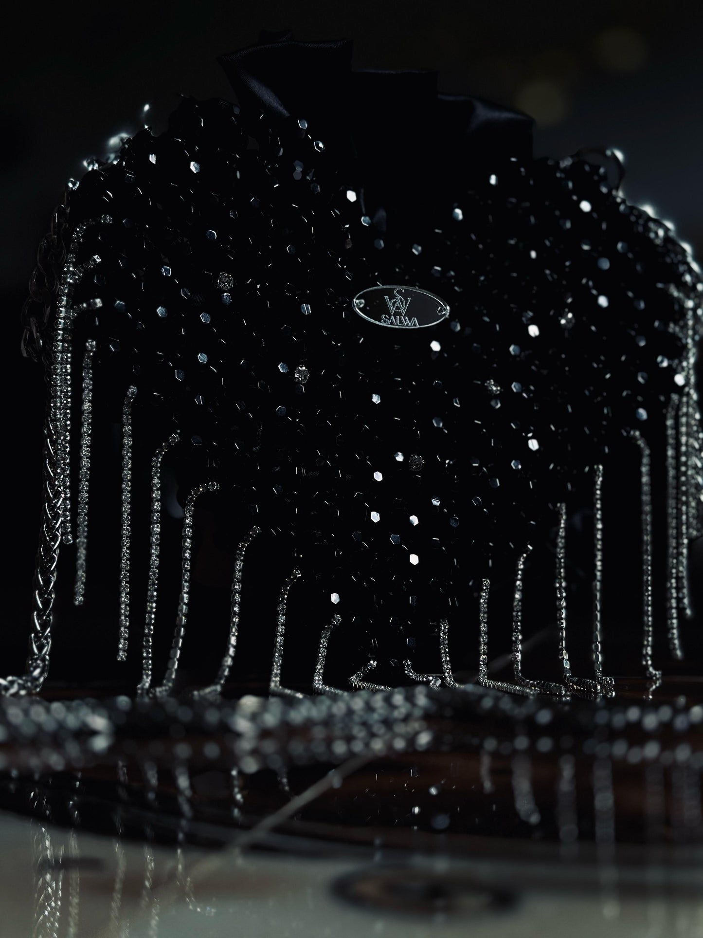 A Black heart-shaped evening bag