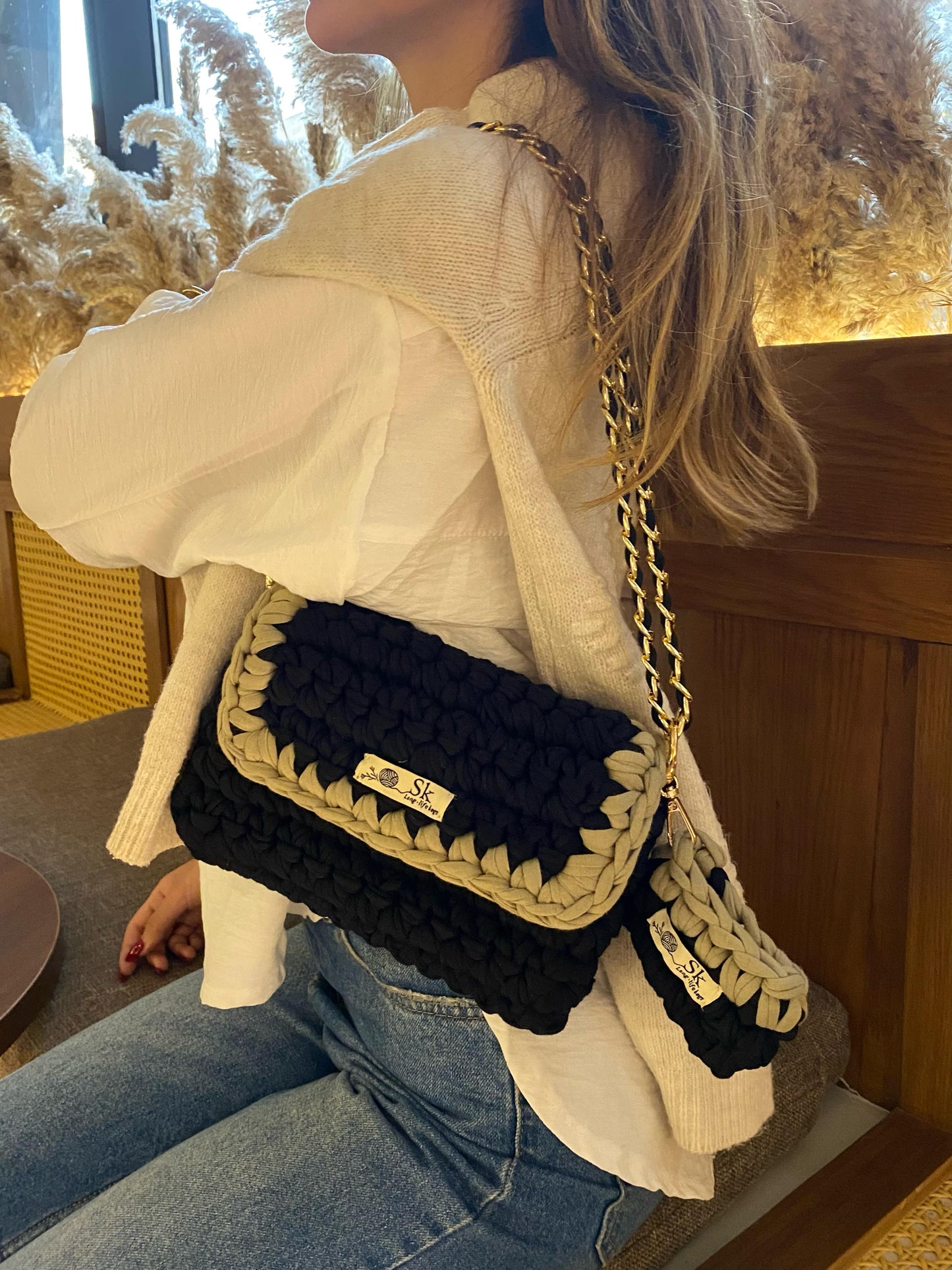 A  aclassic hand and shoulder SK bag