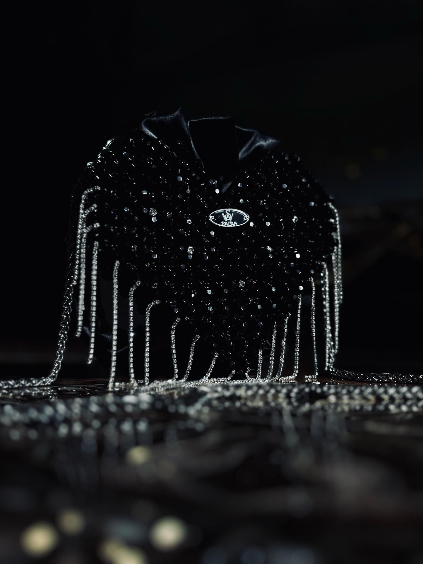 A Black heart-shaped evening bag