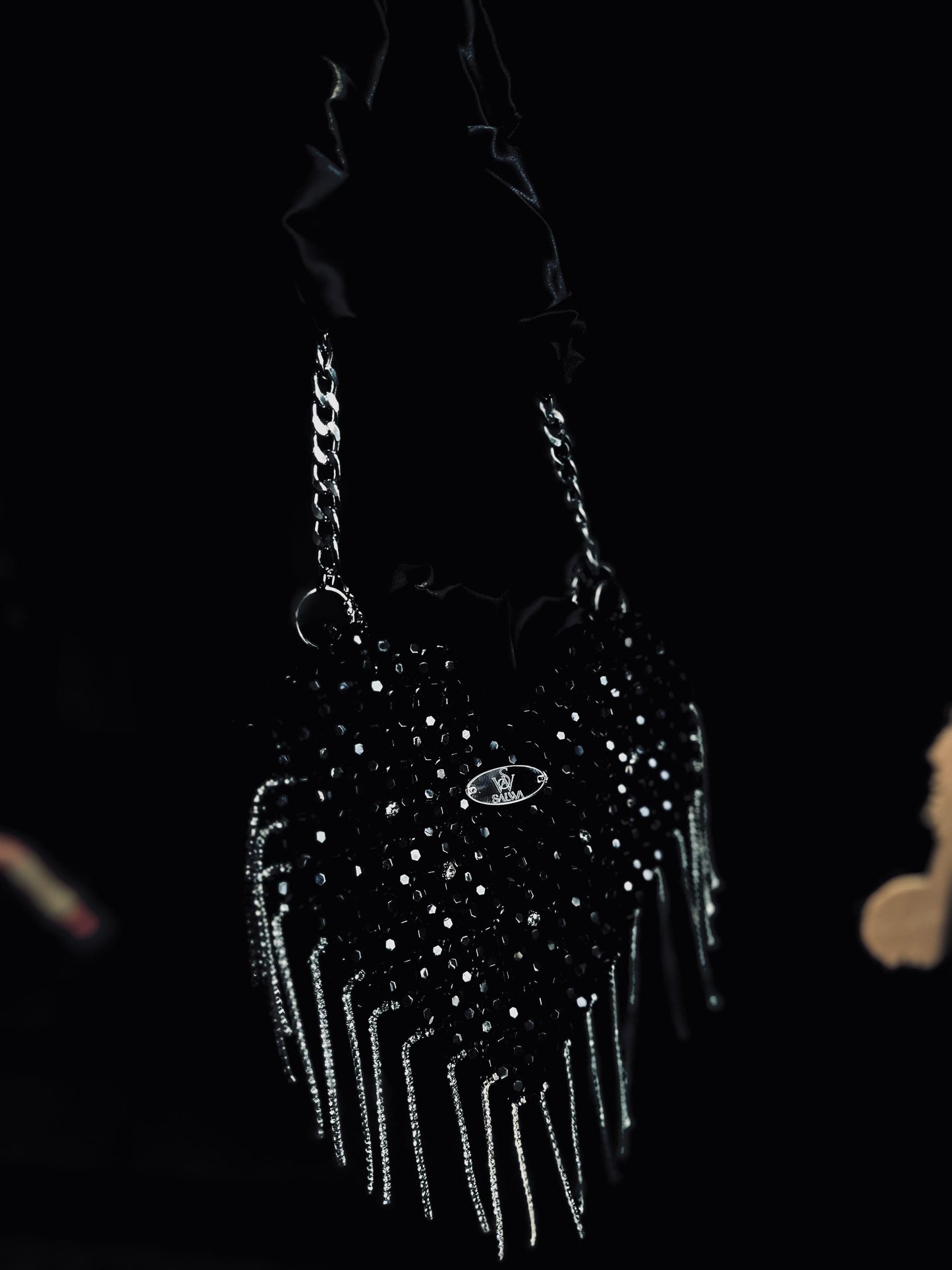 A Black heart-shaped evening bag