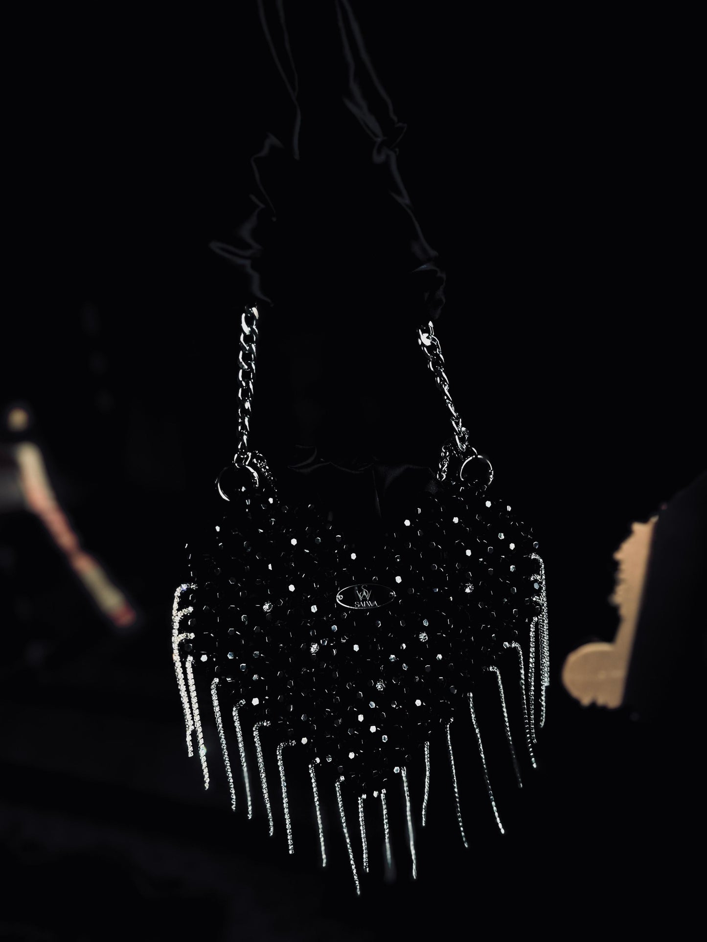 A Black heart-shaped evening bag