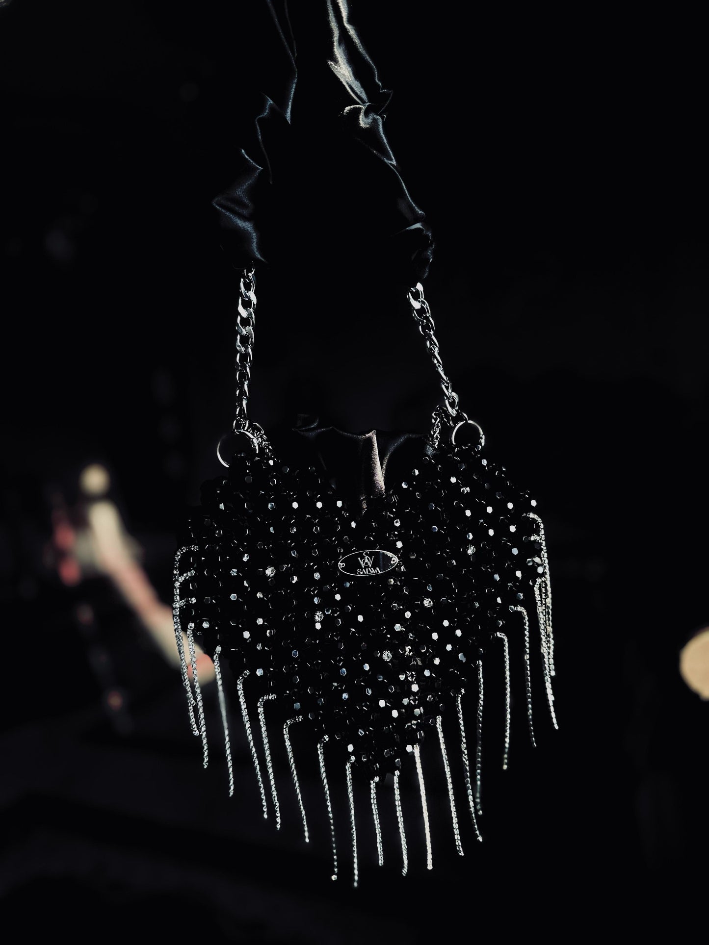 A Black heart-shaped evening bag